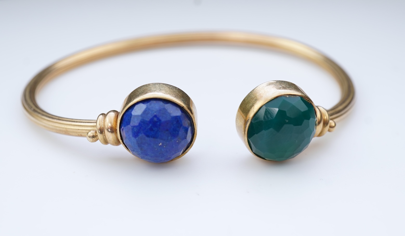A gold, lapis lazuli and green chalcedony bangle
